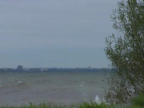 Wave crash spraying to the left side; turbulent water beach Stock Footage 38630930