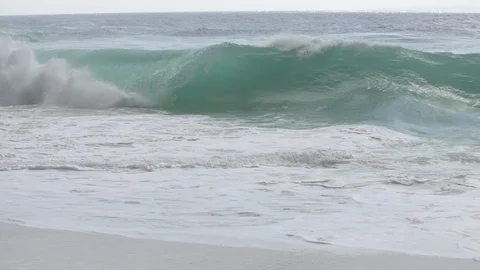 Wave Crashes and Rolls Up the Sand Slow Motion Stock Footage 106785190
