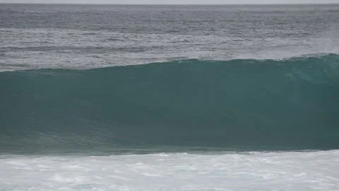 A wave crashes on the beach in Rincon, Puerto Rico. Stock Footage 147944216
