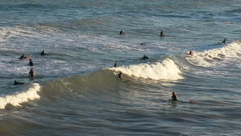 Wave Crashes over Surfers 動画素材 196843747