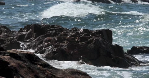 The wave crashes on the rocks Stock Footage 212689532