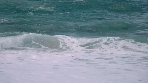 Wave crashing on beach in slow motion at north shore sunset Honolulu Hawaii Stock Footage 313502686