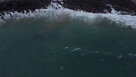 A wave crashing from a drone 動画素材 150361725
