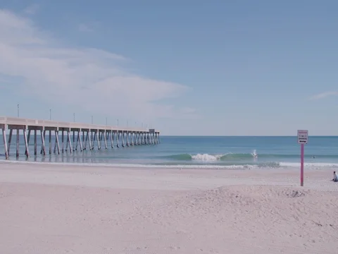 Wave crashing by pier Stock Footage 83606976
