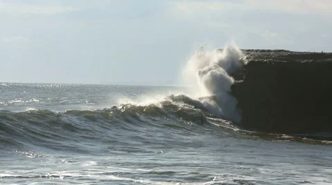 Wave crashing onto rocks Video stock 61793656