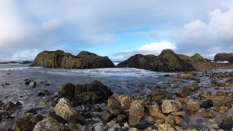 Wave Crashing through Rocks Stock Footage 127595310
