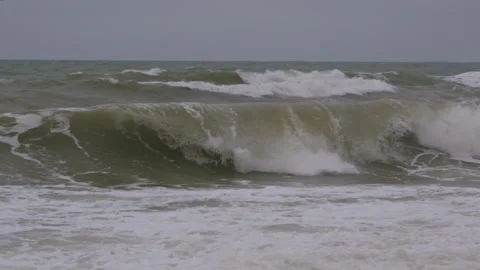 Wave with a crest during a storm at sea in slow motion Video stock 166903842