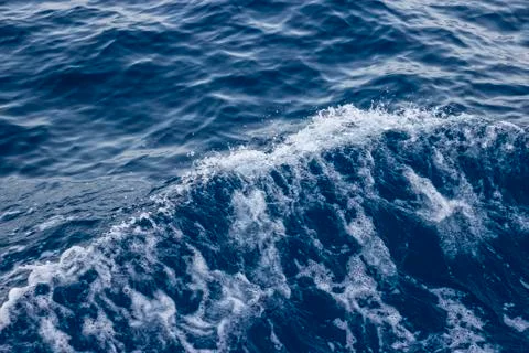 Wave crest on the water surface Stock Photos