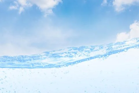 Wave of drinking water and bubble air white sky background. Stock Photos