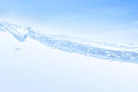 Wave of drinking water and bubble air white sky background. Stock Photos