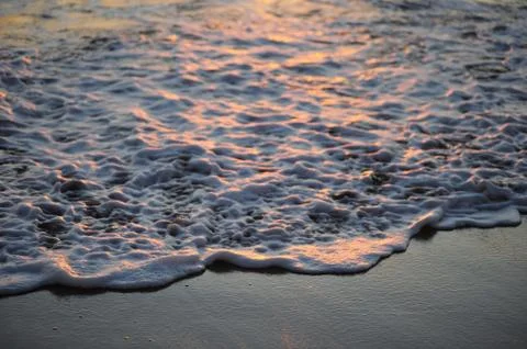 Wave at dusk Stock Photos