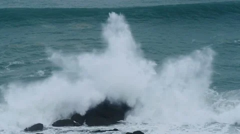 Wave exploding as it hits rocks, Cornwall, UK Stock Footage 58196537
