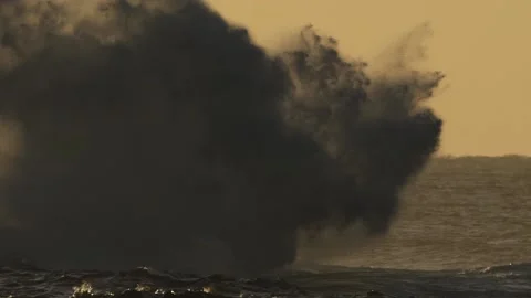 Wave Exploding on Rocks in the Golden Morning Sunrise Stock Footage 199424391