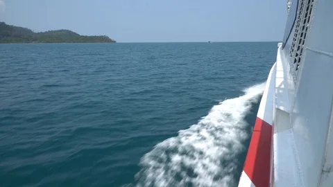 Wave of a ferry ship on the open ocean. Water wake of a boat in the tropical sea Stock Footage 105355901