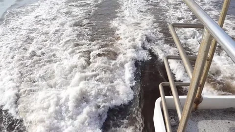 Wave flow from a ship during Daylight Stock Footage 265584031