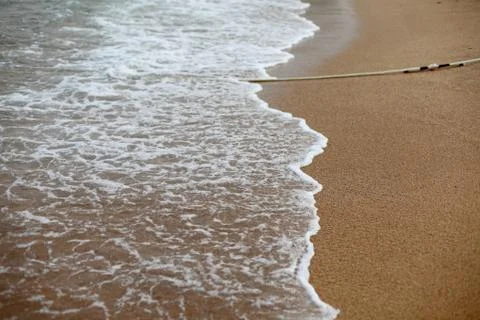 Wave foam on the sand. Foto stock