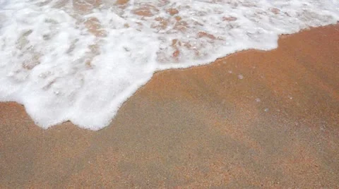 Wave Foam on a Sandy Beach Stock Footage 12310413