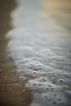 Wave with foam at sunset Stock-Fotos