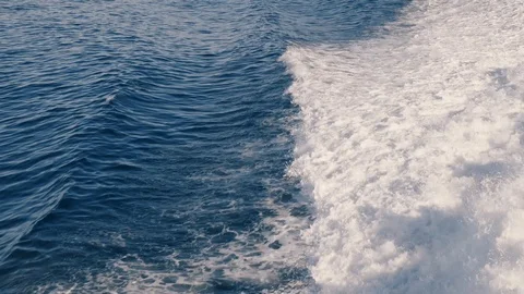 Wave foam trail left from big traveling boat Stock Footage 122794545