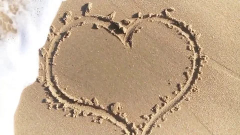 Wave heart sand Stock Footage 79767717