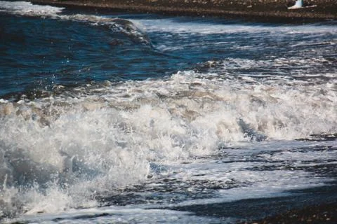 Wave hitting the beach Stock Photos