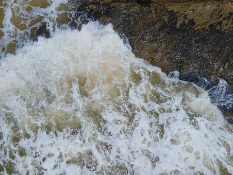 Wave hitting rock Foto stock