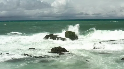 Wave hitting rock in slow motion 7 Stock Footage 127240959