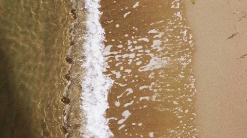Wave hitting the sandy beach, in Aromori Japan 스톡 동영상 265569259