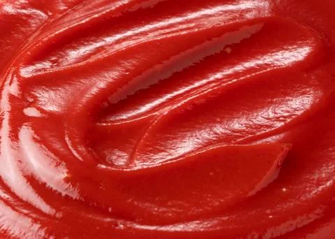 Wave of ketchup on the entire screen Stock Photos