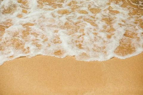 Wave lapping on the shore Stock Photos