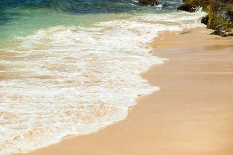 Wave lapping on the shore Stock Photos