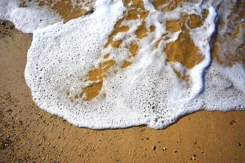 Wave Licking Sand Stock Photos