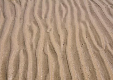 Wave line pattern in beach sand Stock Photos