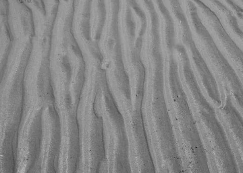 Wave line pattern in beach sand Stock Photos