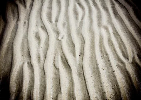 Wave line pattern in beach sand Stock Photos