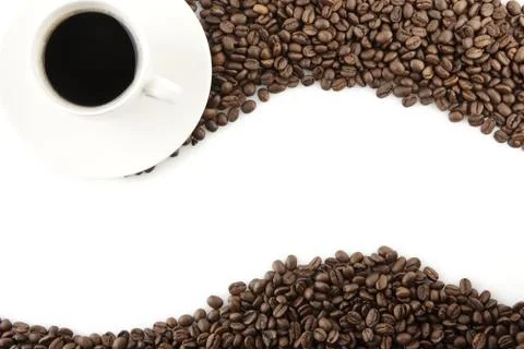 Wave made of coffee beans with cup of coffee on white Stock Photos