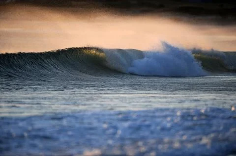 Wave in the morning light Stock Photos