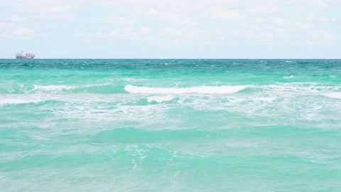 Wave of the Ocean Slow Motion with Cargo Ship in Far Distance Stock-Footage 158345778