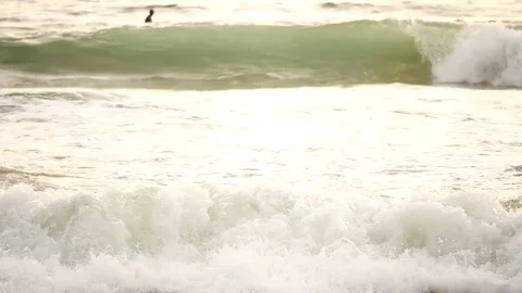 Wave or surf crashing on beach. in the tropical beach with Golden sunlight at Stock Footage 82188534