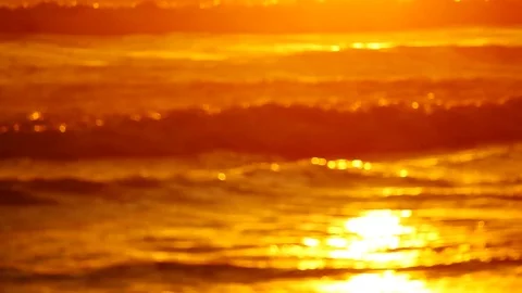 Wave or surf crashing on beach. in the tropical beach with Golden sunlight at Stock Footage 82188571