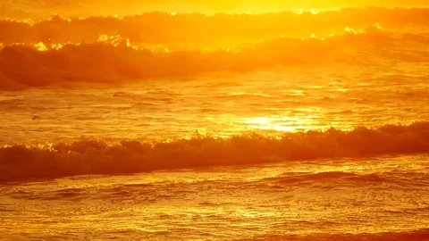 Wave or surf crashing on beach. in the tropical beach with Golden sunlight at Stock Footage 82188635