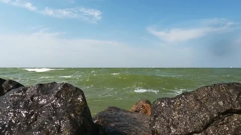 Wave over dike and Gopro 10 (+ audio) Stock Footage 211628891
