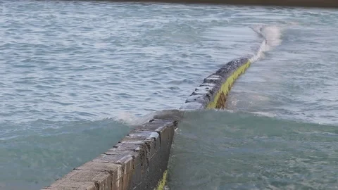 Wave over a groyne. Stock Footage 88369434