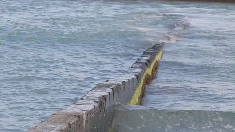 Wave over a groyne. Stock Footage 88369442
