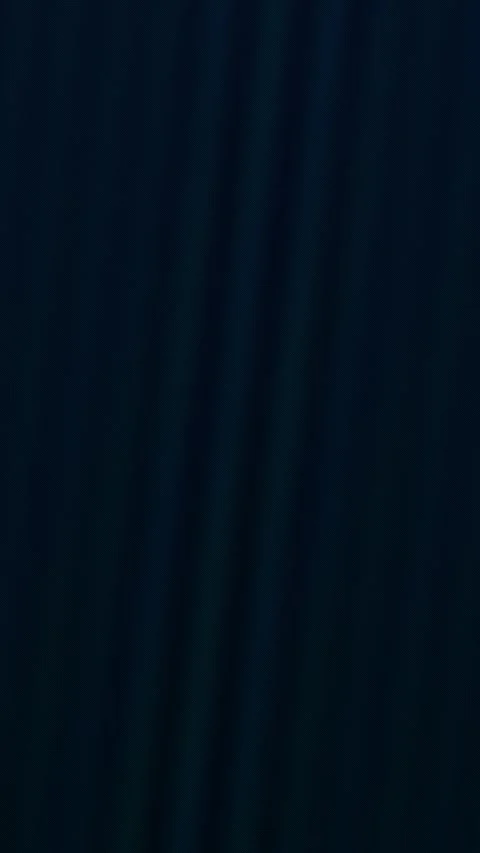 Wave-like patterns ripple across a dark blue gradient background 스톡 동영상 329309552