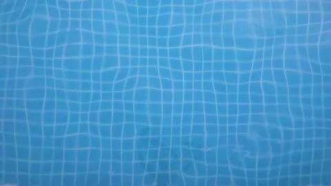 Wave patterns in swimming pool with blue transparent water Stock Footage 179374896