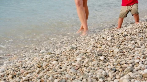 The wave pours the legs of the child Stock Footage 80948144