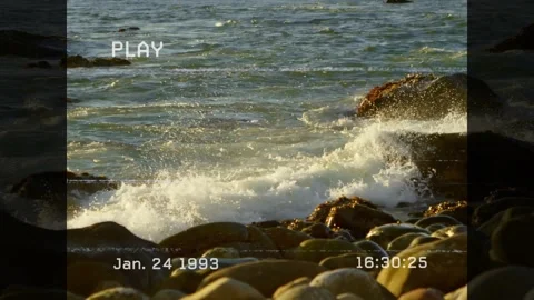 Wave pushing right rock, spraying foam over boulders, receding, rewetting, 스톡 동영상 330188739