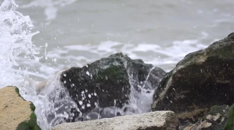 The wave is rapidly moving to the rocks. Slow motion. Stock Footage 53081968
