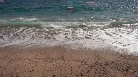 Wave reaching the shore on the beach in slow motion Stock Footage 111762452